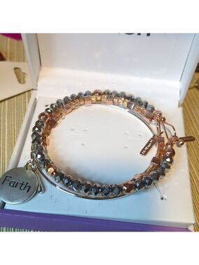 expandable wire and beaded bracelet set with a "Faith" charm.